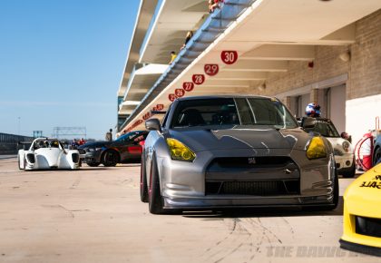 Mike's GTR sitting at the pit with other race cars at the Circuit of the Americas