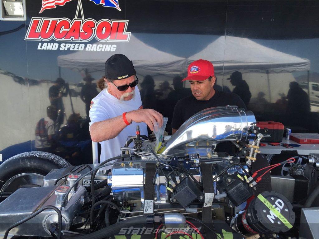 Racers tuning their engine at the raceway