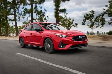 2024 Subaru Impreza RS traveling on a country road