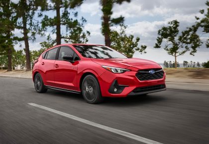 2024 Subaru Impreza RS traveling on a country road