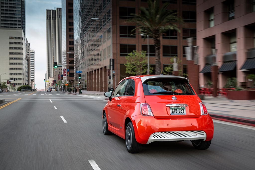 Red Fiat 500e electric car in the city