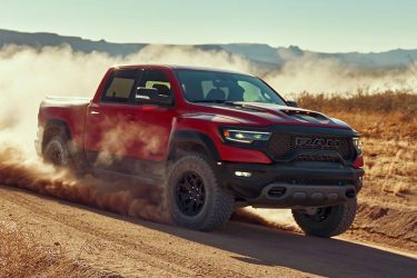 Red RAM 1500 TRX running through the desert