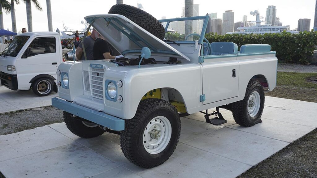 white and blue land rover at L'Automobile