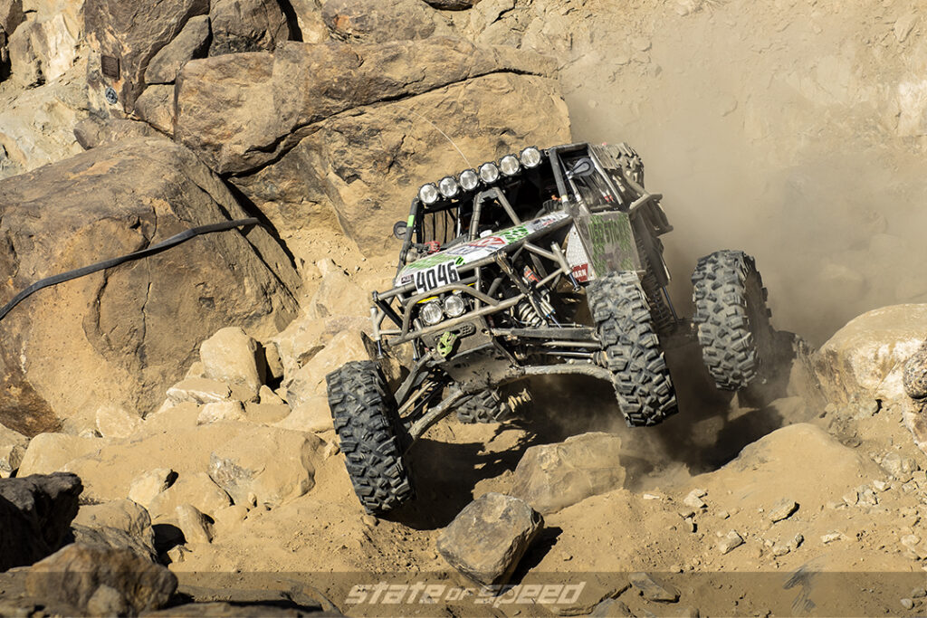 a desert racer launches over some boulders at King of the Hammers 2022