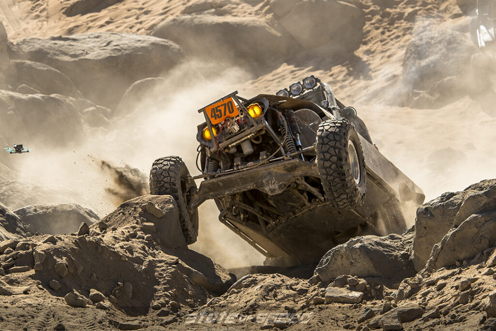 desert racer climbing over boulders at King of the Hammers 2022