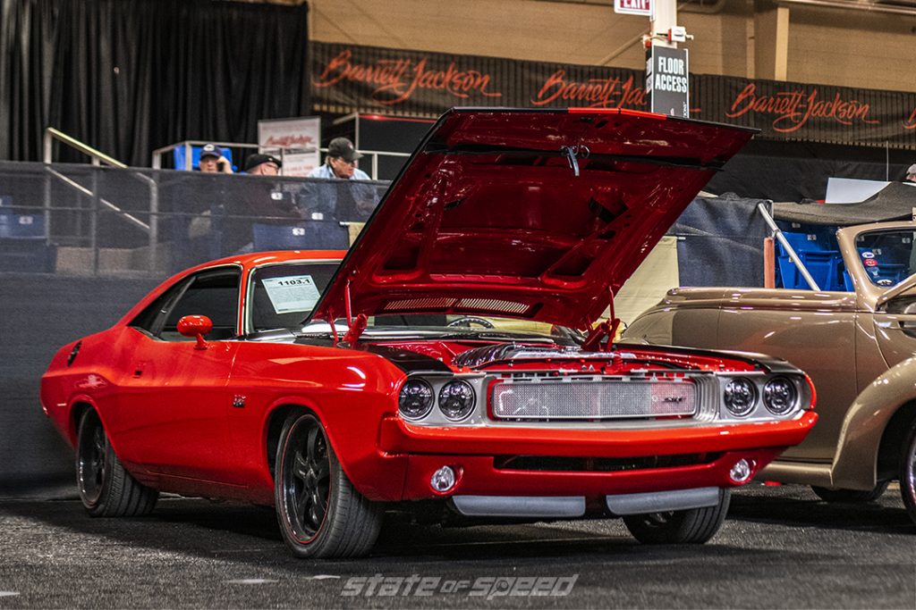 red '70 dodge challenger restomod at an auction