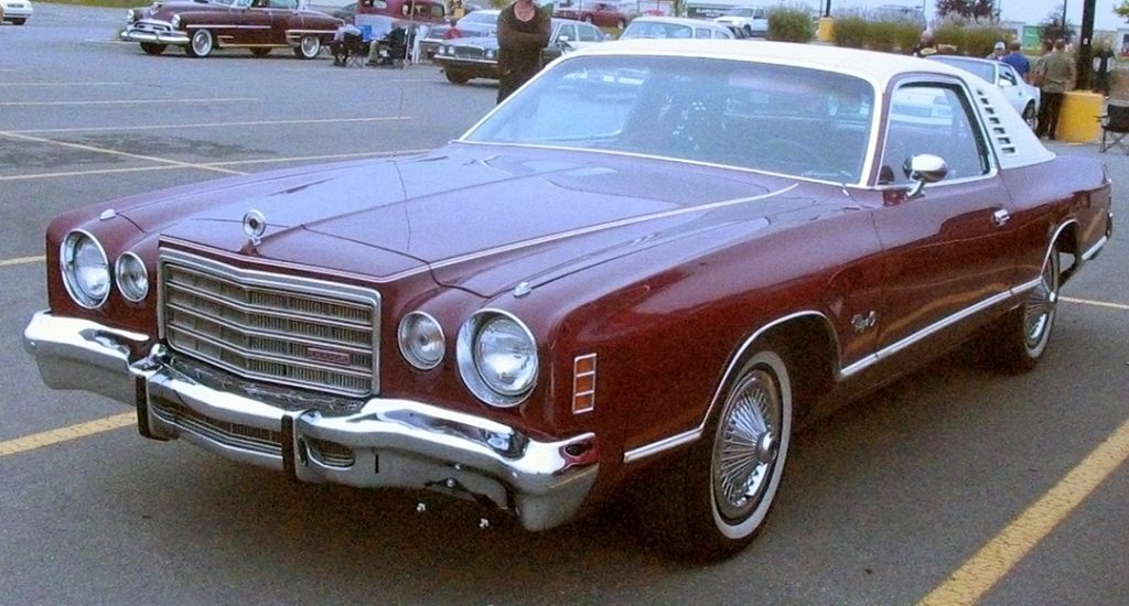 maroon '75 dodge charger in parking lot