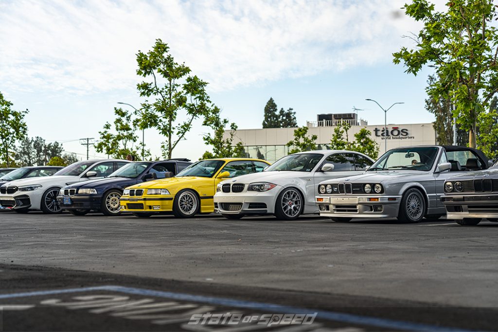 a line of old and new BMWs at state of speed LA 