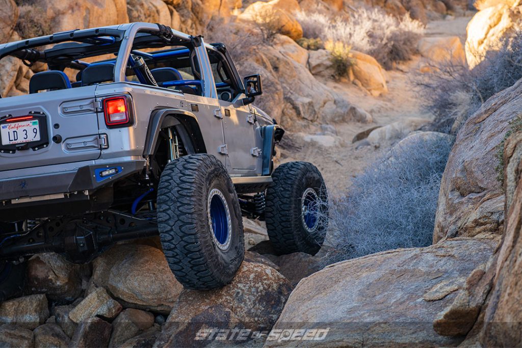 Silver Jeep JLU rock crawling with Milestar Patagonia M/T tires