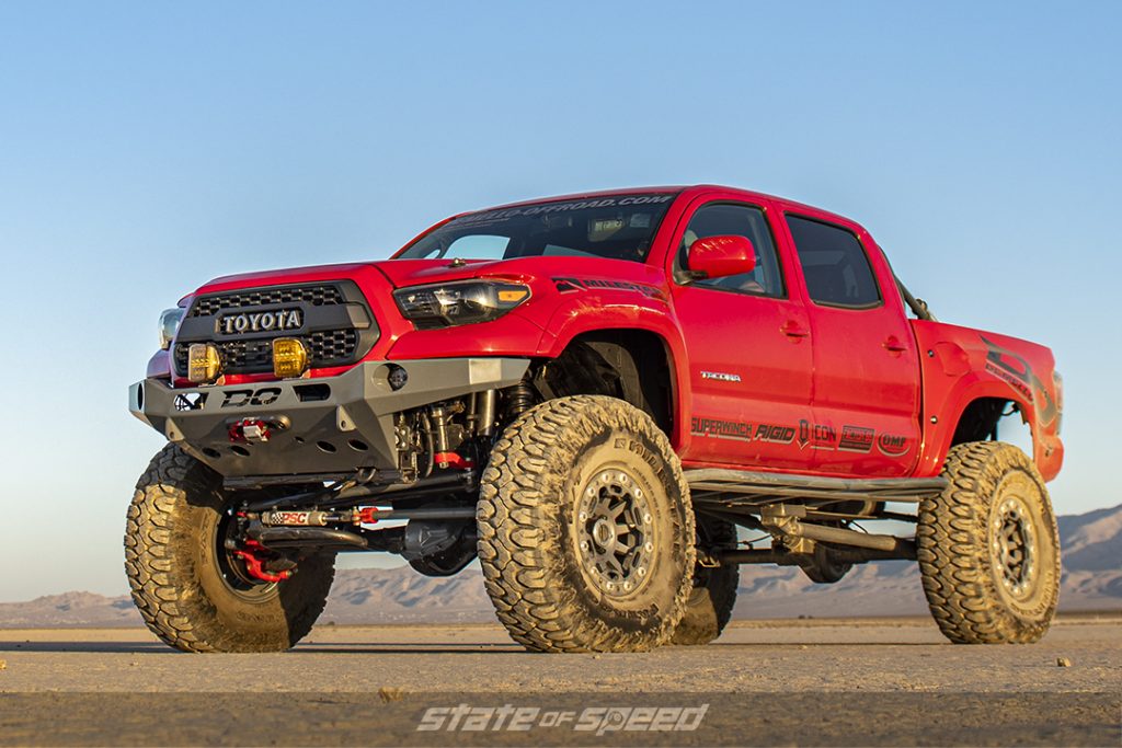 red toyota tacoma in a desert