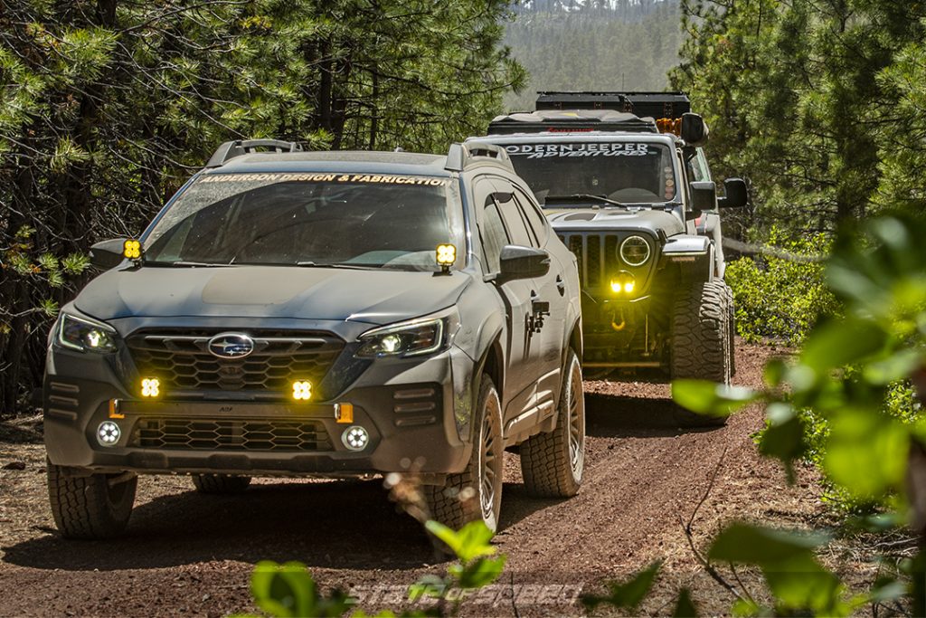 Dusty blue subaru wilderness followed by a gray jeep on a trail in deschutes national forest