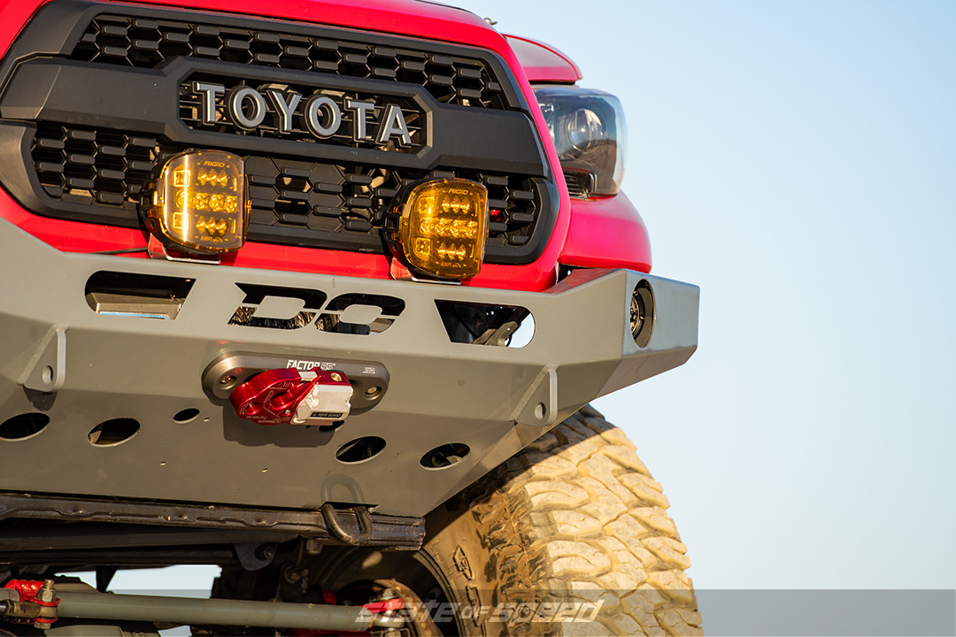 Demello Offroad custom bumper on a red Tacoma 