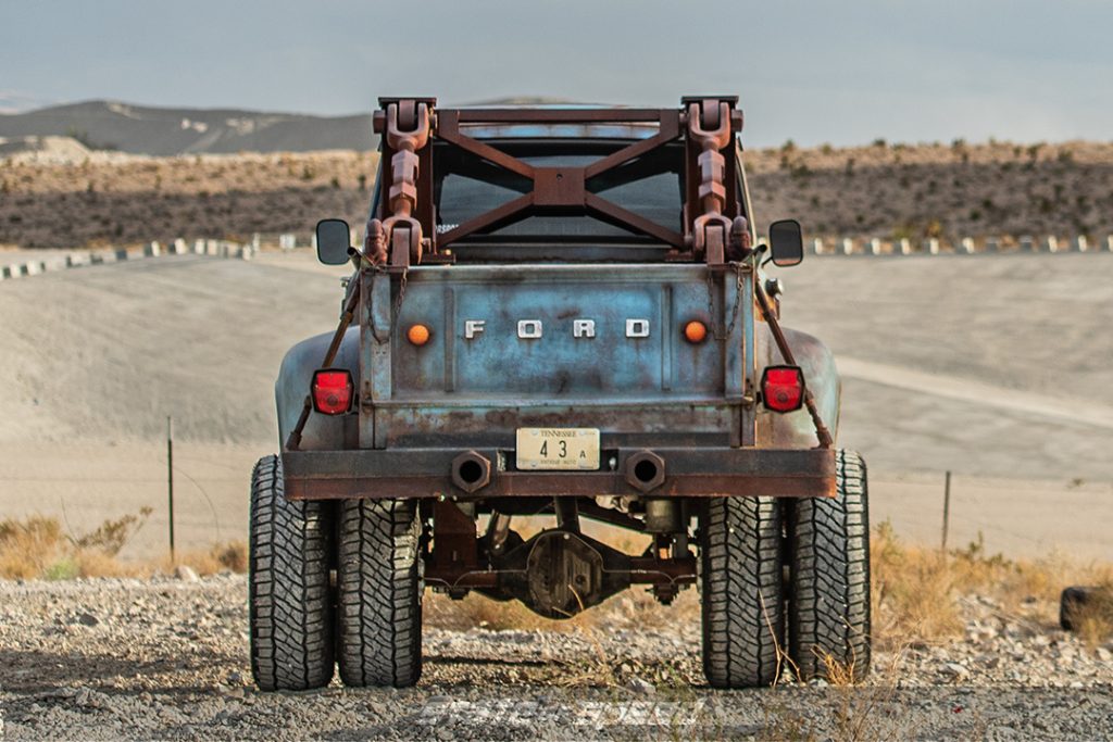 rear of hodson motors ford f600 truck in desert on milestar off-road tires