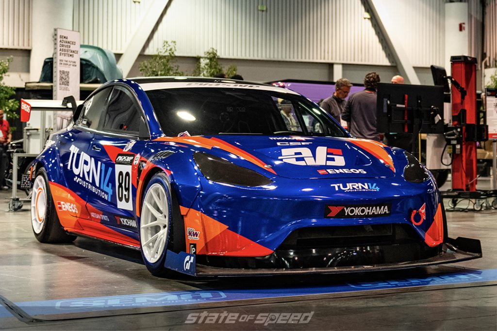 blue and orange tesla model 3 at SEMA 2022