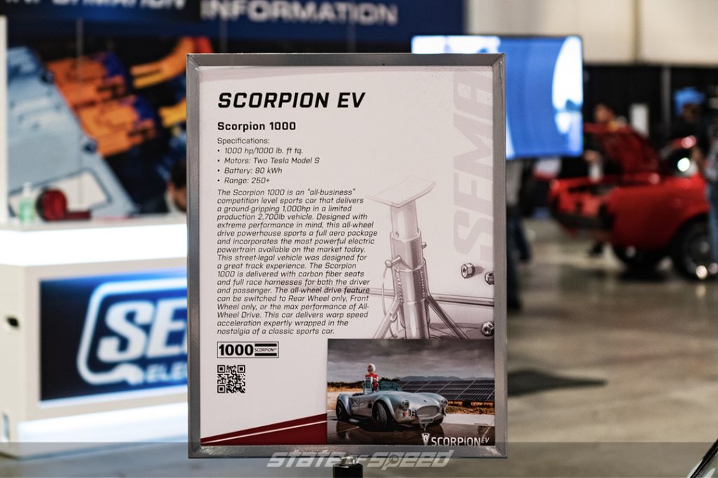 Blue with white stripes electric AC Cobra by Scorpion EV at SEMA 2022