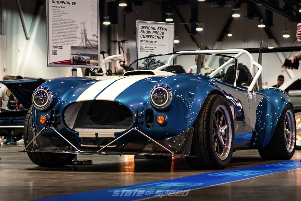 Blue with white stripes electric AC Cobra by Scorpion EV at SEMA 2022