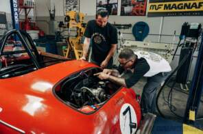 Jimmy and his assistant working on the Porsche Speedster engine