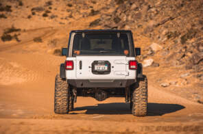 Back view of modified Jeep JL Wrangler in the desert