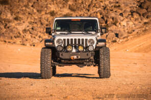 Front view of modified Jeep JL Wrangler in the desert