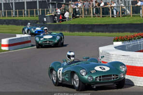 Vintage Aston Martin race cars on the track at Goodwood Revival