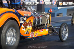 Open engine on a drag racing vehicle