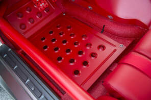 Custom red floor panels in this classic car