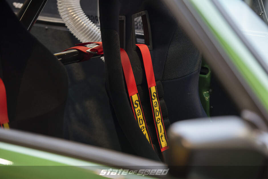 Rebellion Forge Racing BMW E30 interior with Sabelt racing harness