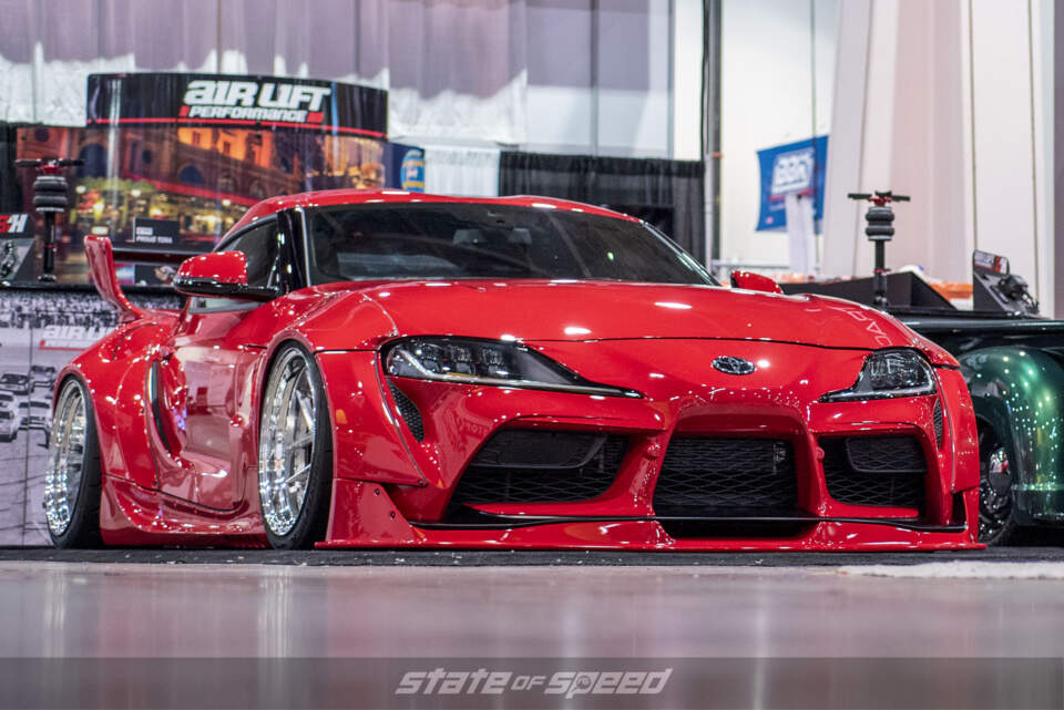 Air bagged lowered Supra with the Pandem body kit at the Air Lift Performance booth