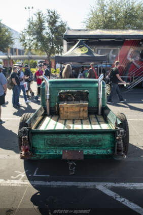 Rat rod Chevrolet next to the Mecum auctions booth at SEMA