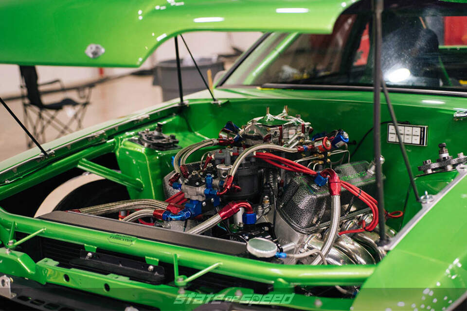 engine bay of mustang with nitrous