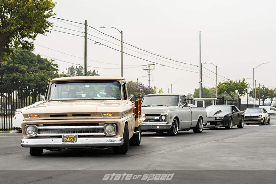 Brown first gen Chevrolet C10 pick up truck, grey second gen Chevrolet C10, and Black third gen chevrolet camaro at State of Speed Los Angeles LA