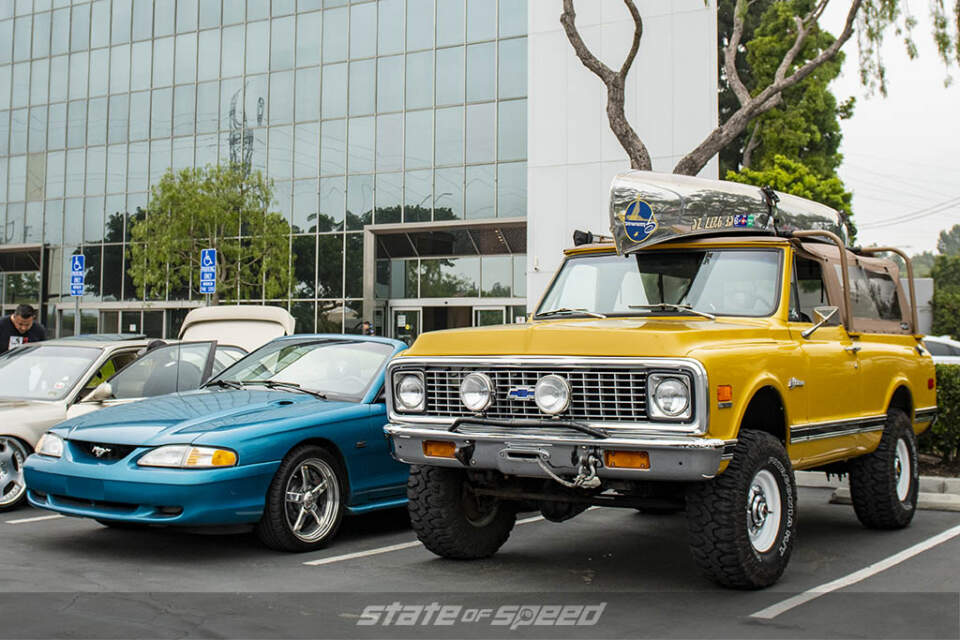 Teal Ford Mustang 4th gen and mustard yellow Ford Bronco at State of Speed Los Angeles LA