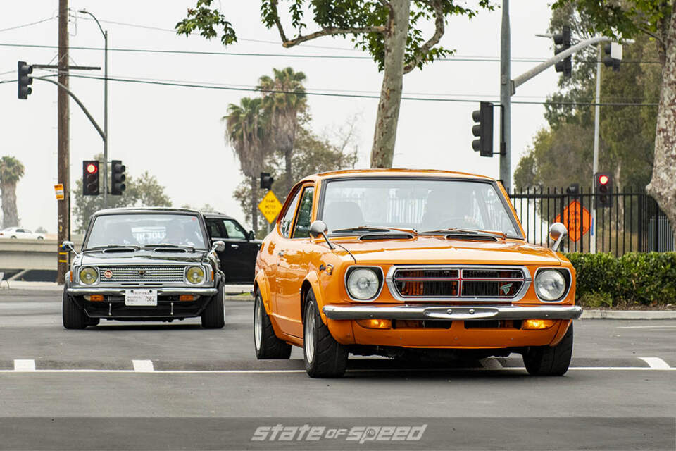 Black Toyota corolla and orange toyota sprinter at state of speed Los Angeles LA