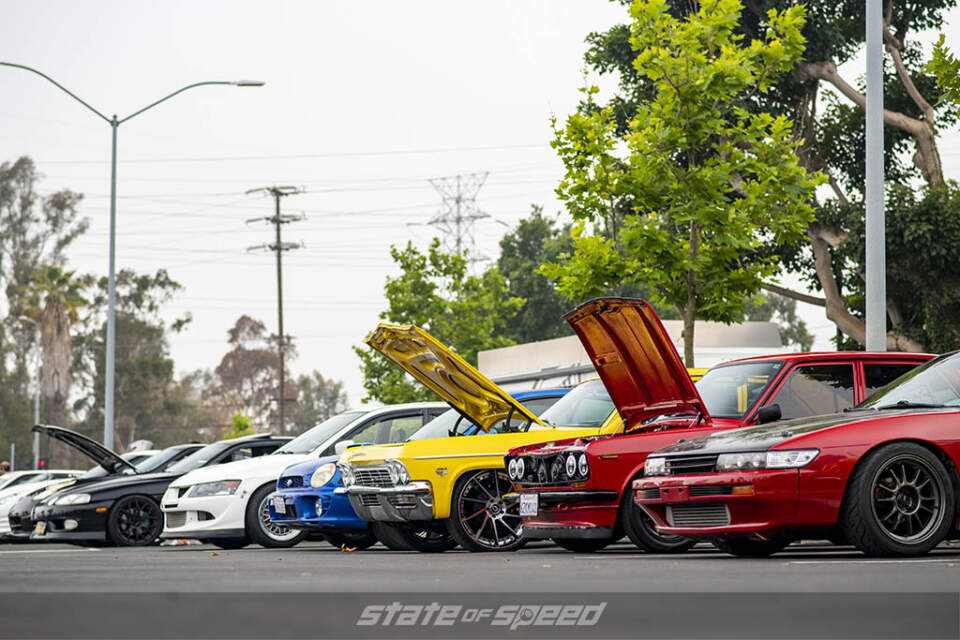 Red and black Nissan Silvia, blue Subaru WRX, white Mitsubishi Evo at State of Speed Los Angeles LA